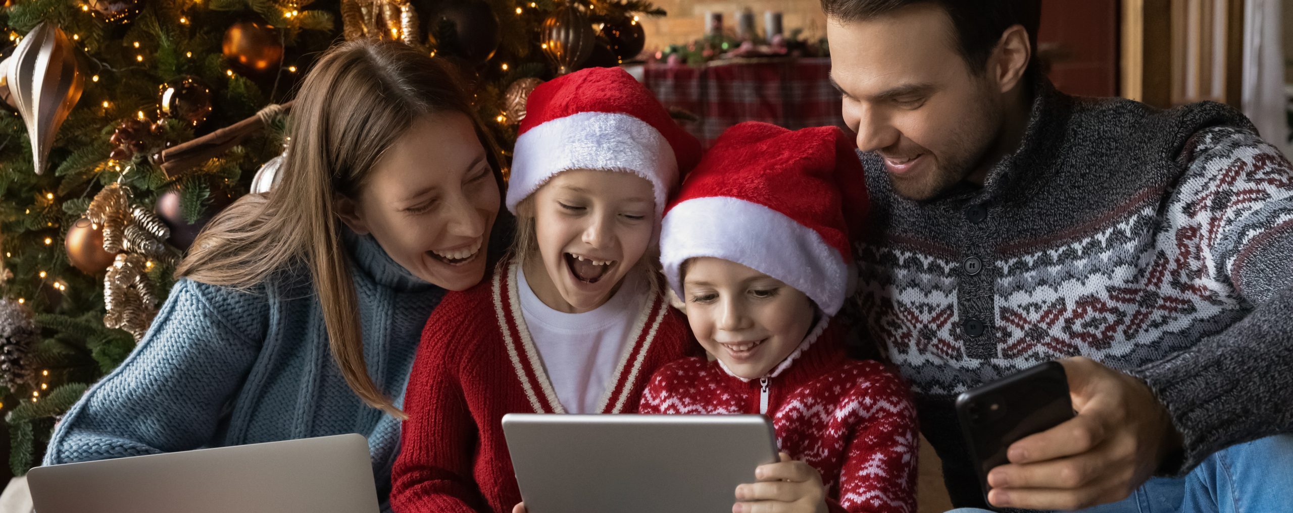family at christmas electronics gadgets